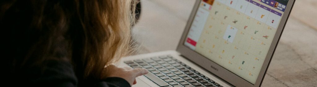 Close up of student using laptop