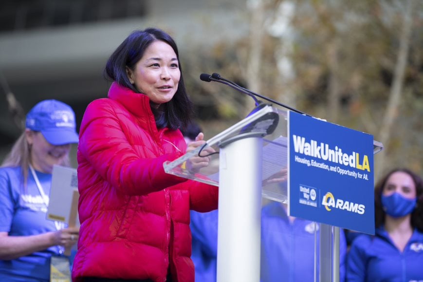 Photo of Irene Oh speaking at a podium during WalkUnited