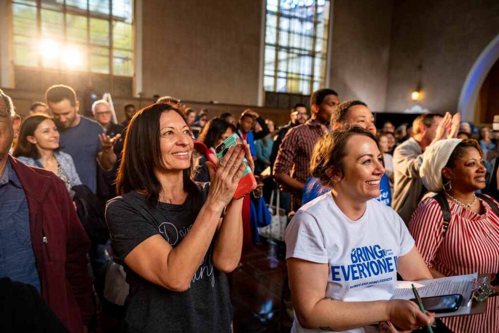 Smiling crowd of people at a United Way event
