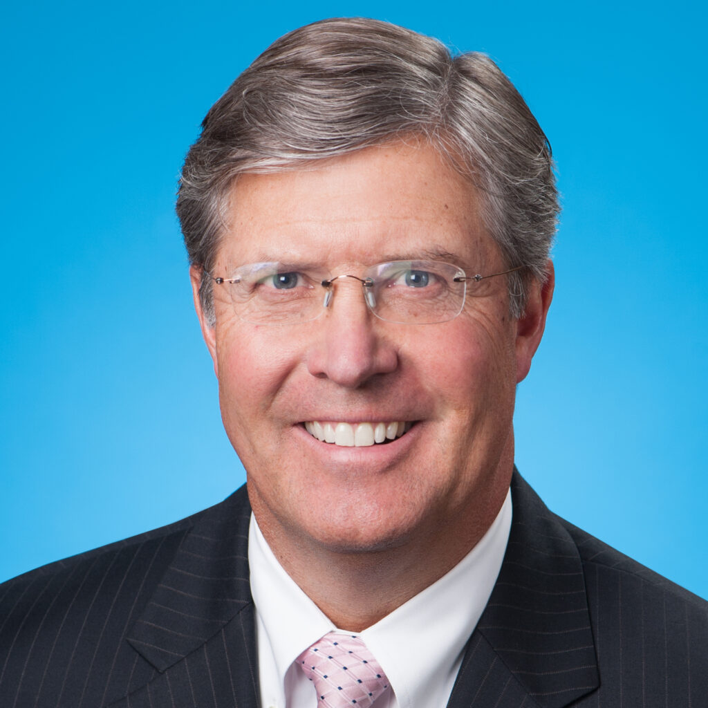 Headshot photo of Chris Carey smiling