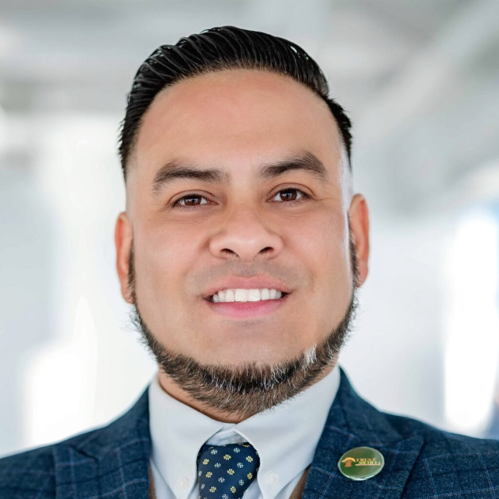 Headshot photo of Edgar Campos smiling