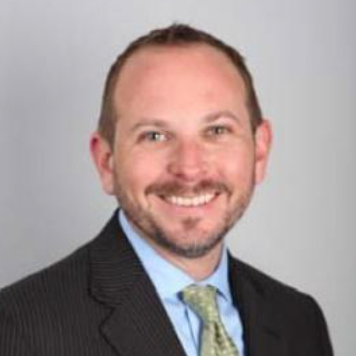 Headshot photo of Erik J Robinson smiling