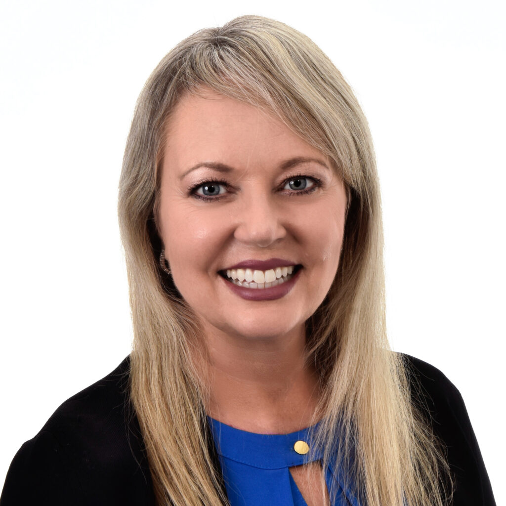 Headshot photo of Michelle Wroan smiling