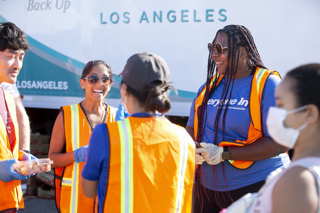 Smiling Volunteer At A Food Drive