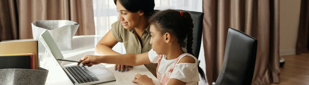 mom and daugher working on homework