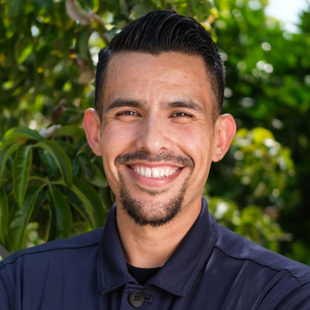 Headshot photo of Rudy Espinoza smiling